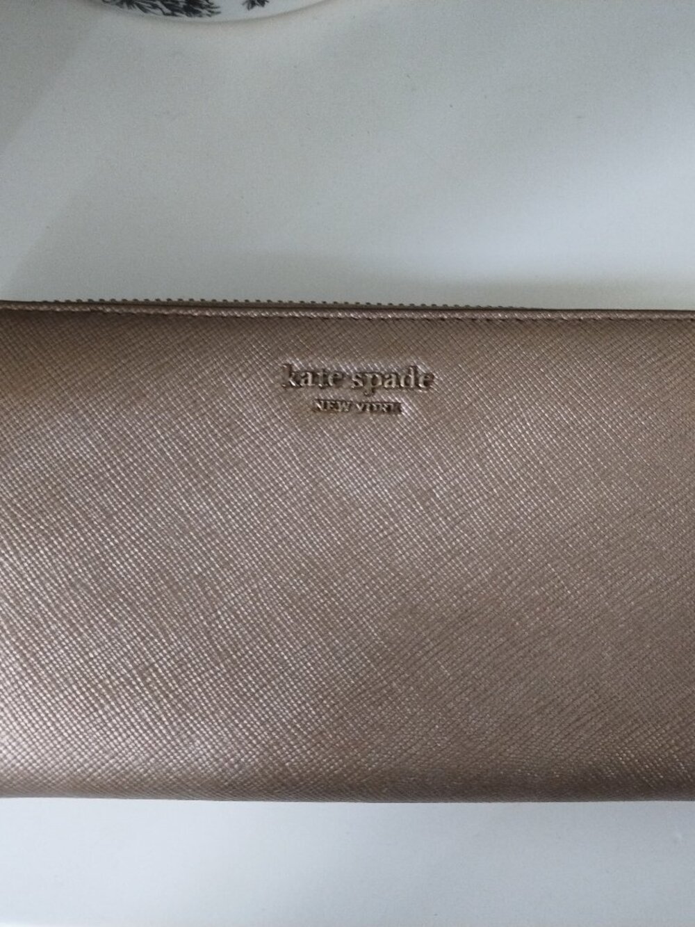 Kate Spade Rose Gold wallet with gold tone zipper